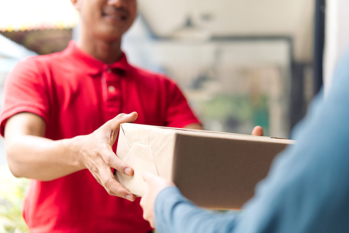 Person handing over a parcel